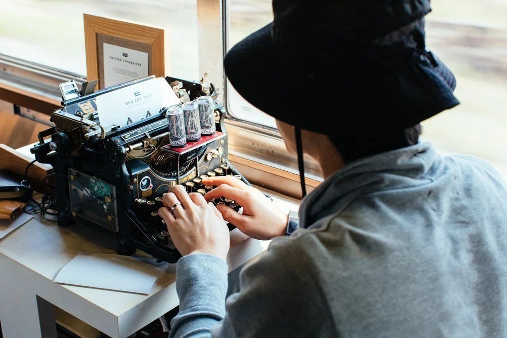 Levi's Tools, artist typing on train